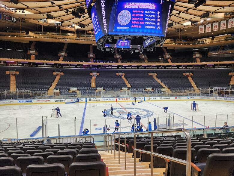 Youth Hockey players playing in a large arena