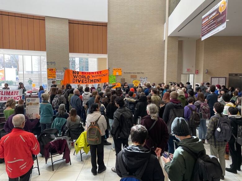 People gathered at the Mc Divest rally on Friday.