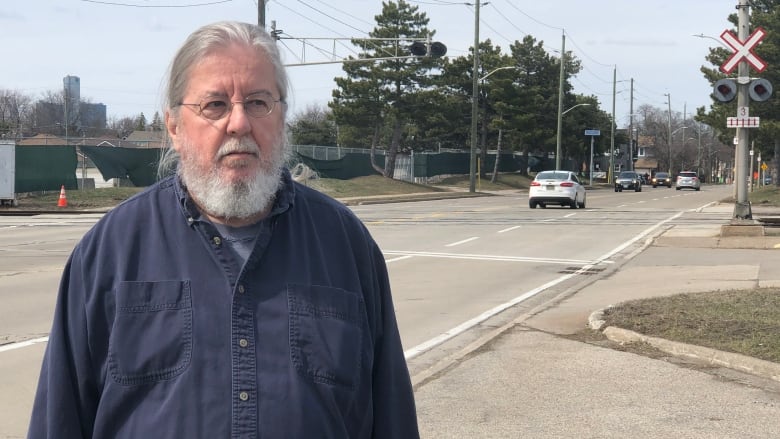 John West stands near the ETR crossing at Kildare Road. He says the sound of train whistles at this crossing are disturbing his sleep and have increased since October.