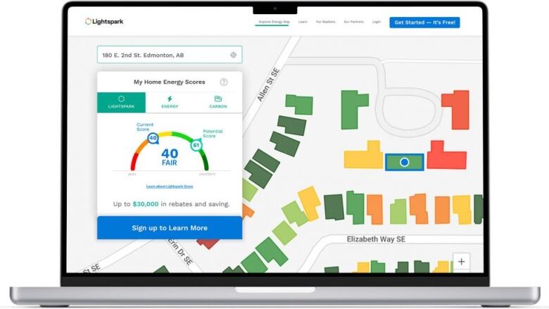 A laptop screenshot shows the energy score of an address in Edmonton.