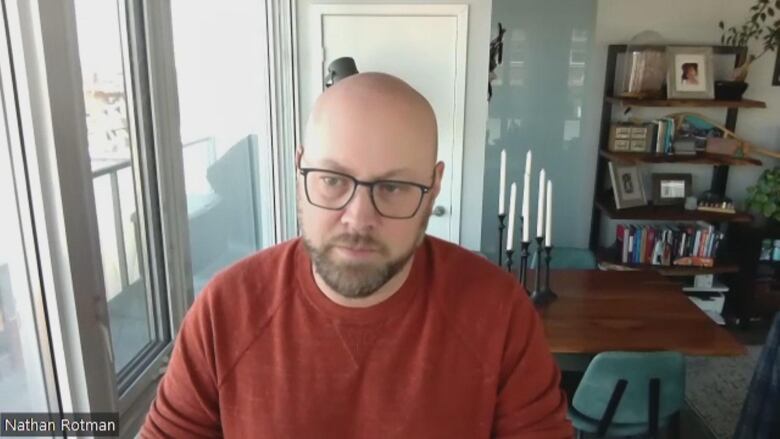 A man with beard and glasses