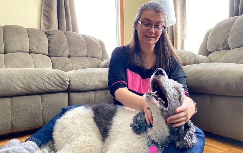 Bardeggia on her living room floor with Trixie