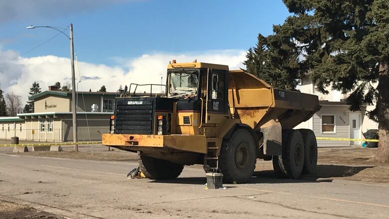 A piece of heavy machinery with damaged windshields.