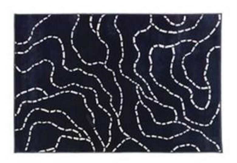 A rug which is dark blue and has dotted lines over it.