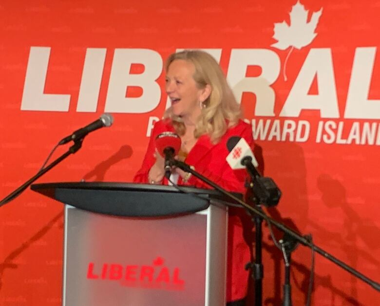 Sharon Cameron at a podium.