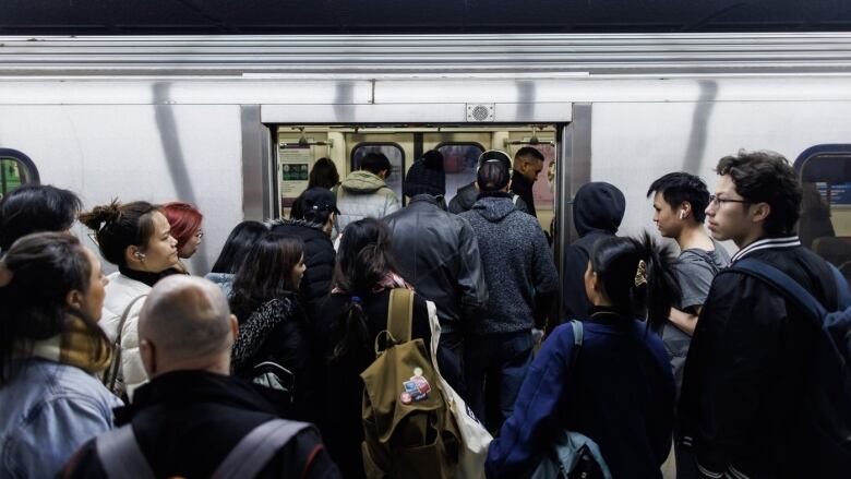 People entering a subway. 