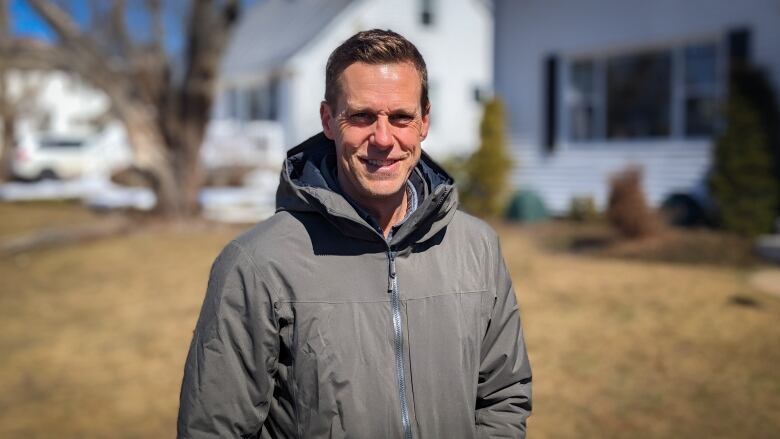 Man in parka smiles