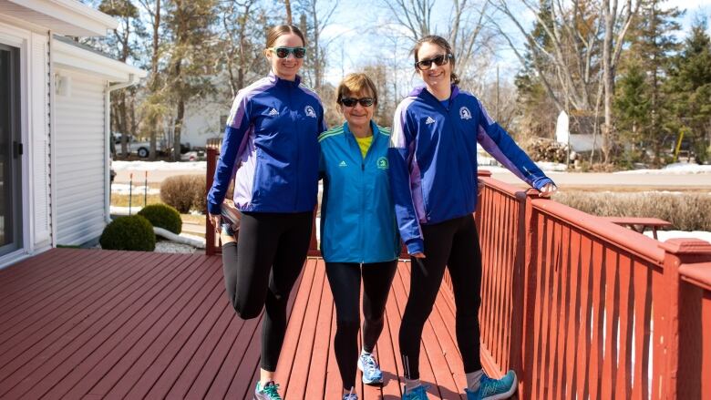 Dorothy Gregory is flanked by her daughters Carrie Gregory, left, and Sandra Cottreau.