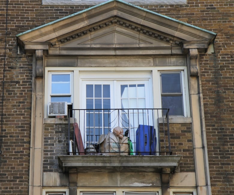 suitcase and box on balcony