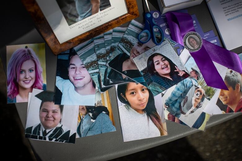 A layout of photos of people on a table. 