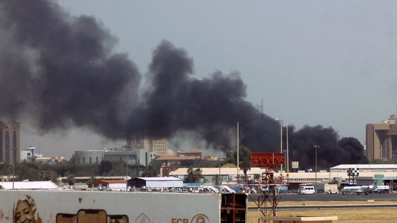 Heavy smoke rising from airport area in Khartoum, Sudan.