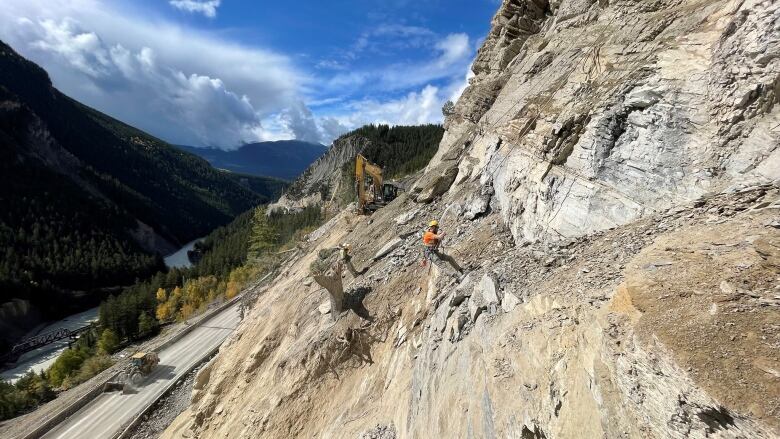 A file photograph from Transportation B.C. showing a rock scaler at work in the Kicking Horse Canyon in 2021.