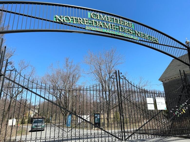 A cemetery's gate are closed shut.