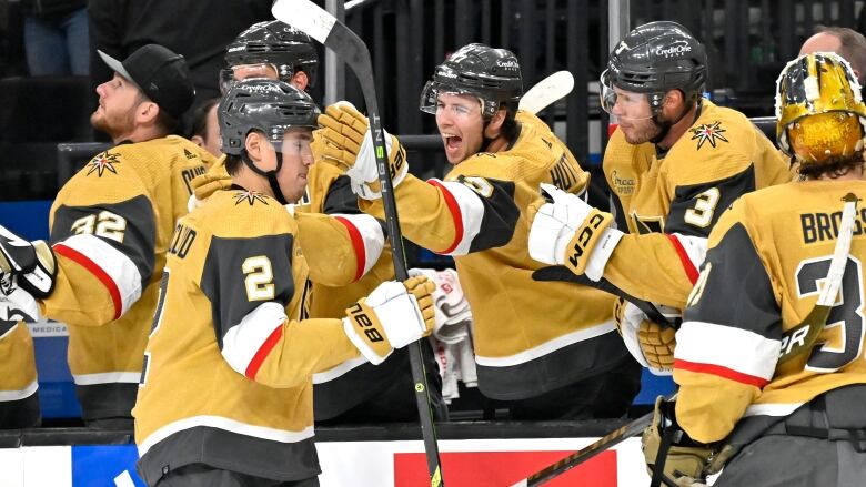 A celebration among teammates after scoring a goal.