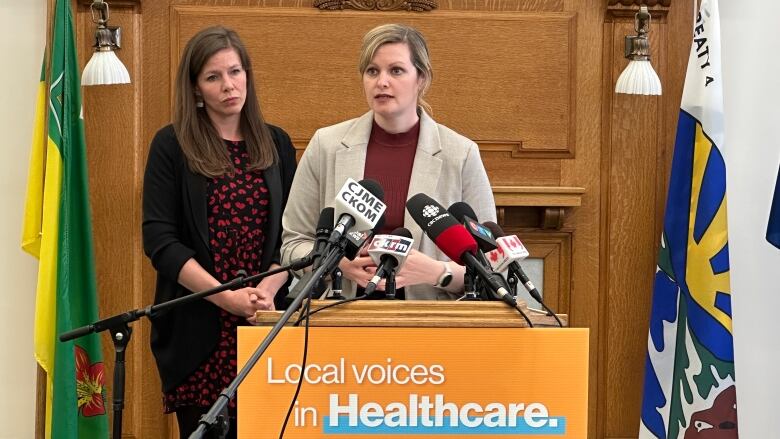 Opposition NDP health critic Vicki Mowat (right) and NDP MLA Meara Conway (left) speak at a news conference on Tuesday.