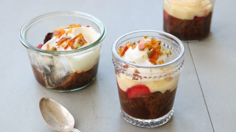 Trifles sit on a counter, with layers of gingerbread, strawberry jelly and cream.