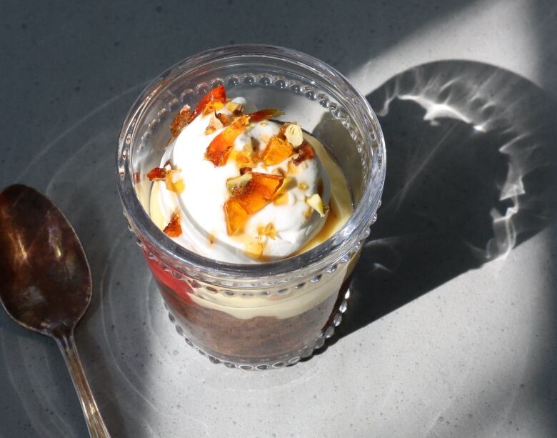 A trifle seen from above, with candied pistachios on top.