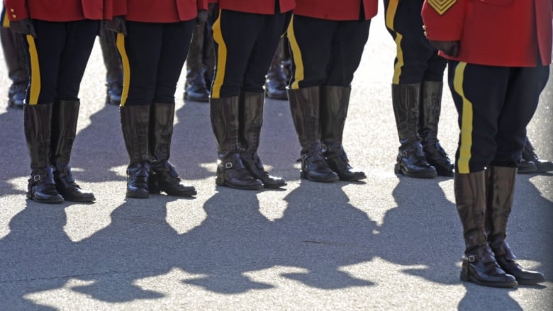 RCMP officers line up before a memorial for fallen mounties at RCMP Depot in Regina, Sask., on Sunday, Sept. 13, 2015. The Alberta government is looking to hire a contractor and an executive manager for a proposed provincial police force that would replace the RCMP.