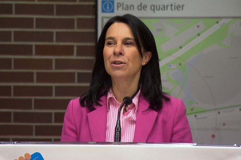 woman talking at podium