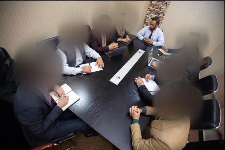 An undated photo of lawyer Saeeq Shajjan and his employees in Kabul.  On August 14th, 2021, he told his staff to go work from home and be with their families as the Taliban entered the Afghan capital.