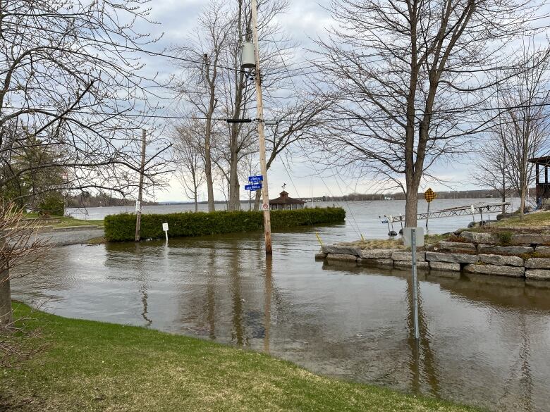 River water floods the end of a road.