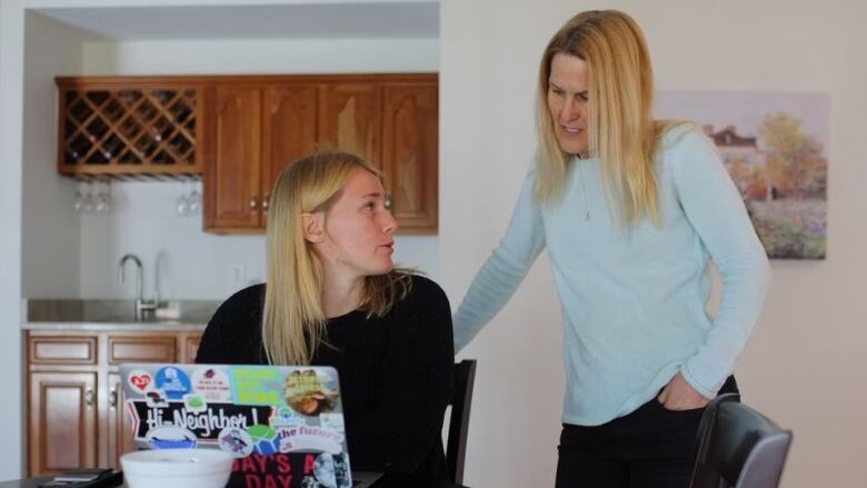 Lexi Nelson talks to her mother Wendy about her income tax filing at their home in Foxborough, Massachusetts, U.S., March 21, 2023.