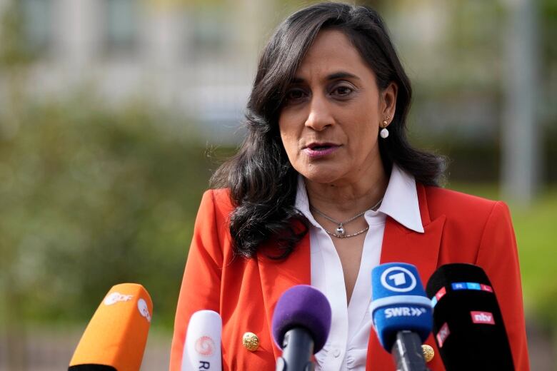 Canada's Defense Minister Anita Anand talks to journalists during a press statement prior to the meeting of the 'Ukraine Defense Contact Group' at Ramstein Air Base in Ramstein, Germany, Friday, April 21, 2023.