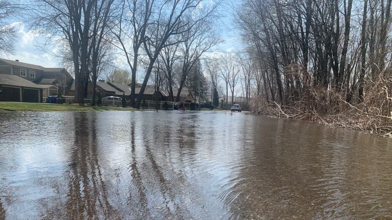 Flood waters cross a road 