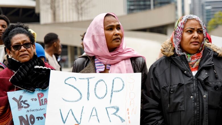 Supporters and members of Torontos Sudanese community hold a rally to oppose fighting in Sudan at Nathan Phillips Square in Toronto on April 23, 2023.