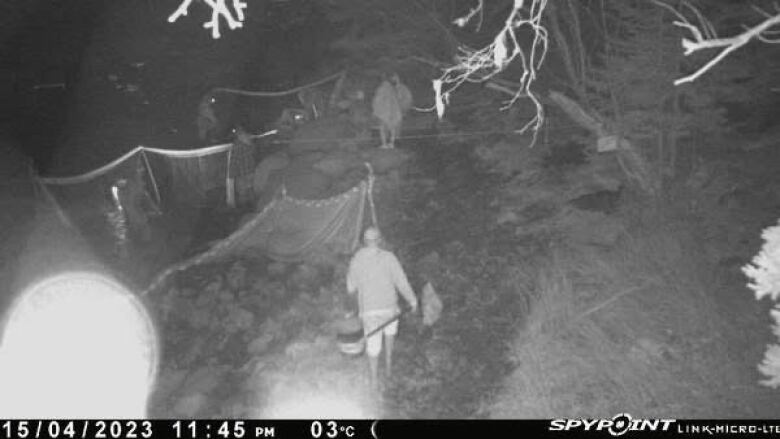 a black and white image of elver poaching.