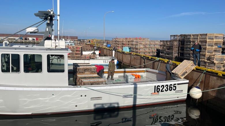 Lobster traps stacked high at Beach Point Wharf.