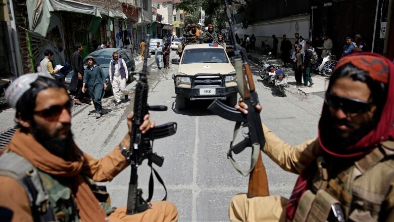 Taliban fighters on patrol, days after the Taliban swept to power in Afghanistan in August 2021.