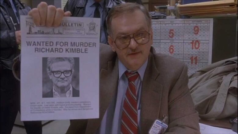 Colin Firth Photoshopped onto a wanted poster for Dr. Richard Kimble from the movie The Fugitive.