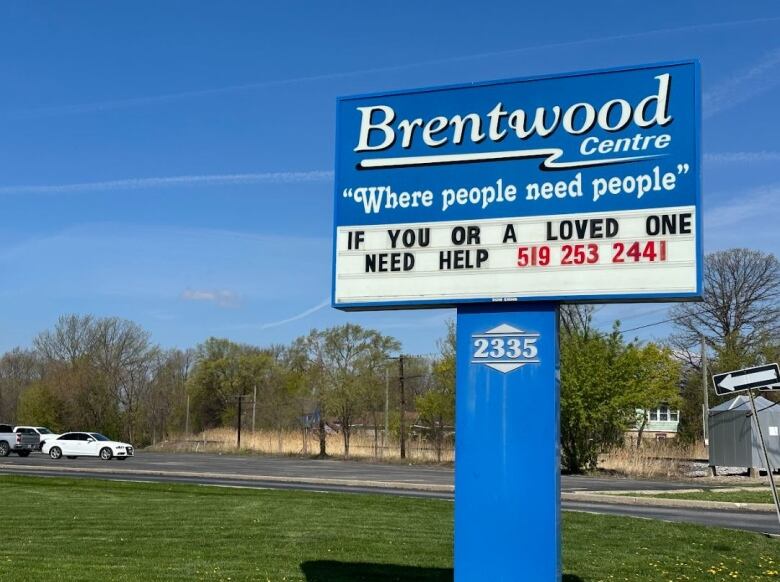 A blue sign reads 'Brentwood centre. Where people need people. If you or a loved one need help, 519- 253 - 2441.