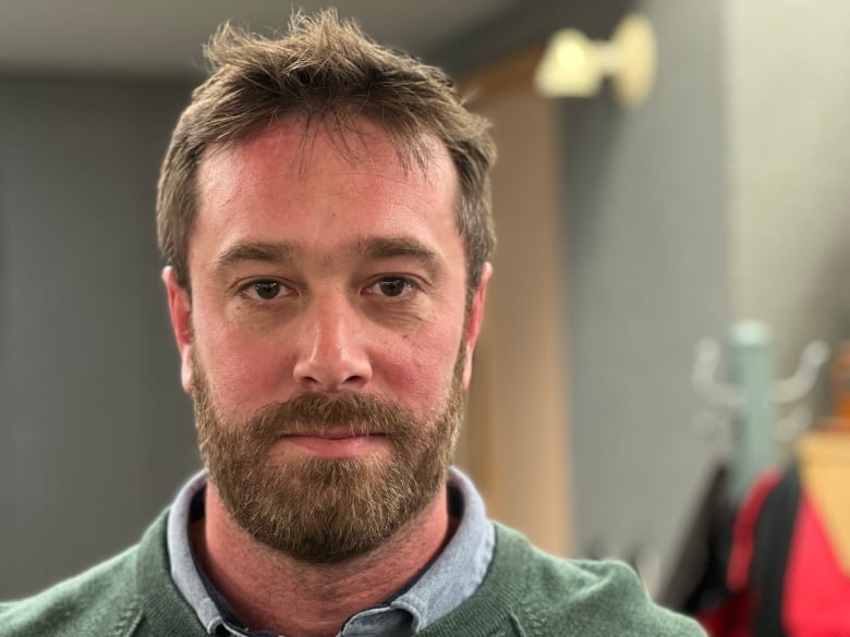 Portrait of a middle-aged man with a beard.