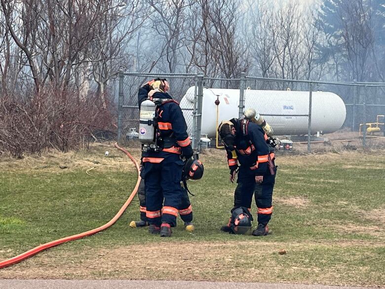 Fire crews keeping a close eye on a large propane tank 