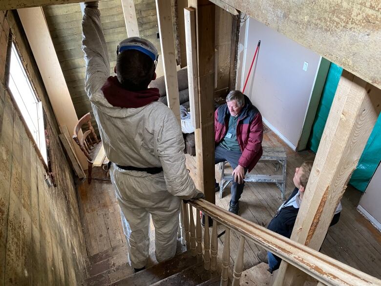 Volunteers with the Mennonite Disaster Service are shown inside a Cape Breton home that was damaged by the affects of Hurricane Fiona. 