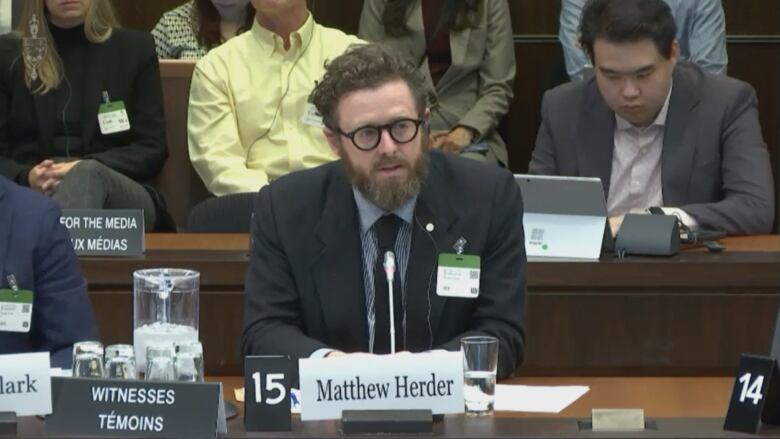 Matthew Herder speaking at a health committee on allegations that Health Minister Jean-Yves Duclos interfered with PMPRB's work to delay guidelines that would help lower drug costs.