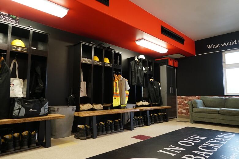 A space that resembles a locker room and firehall.