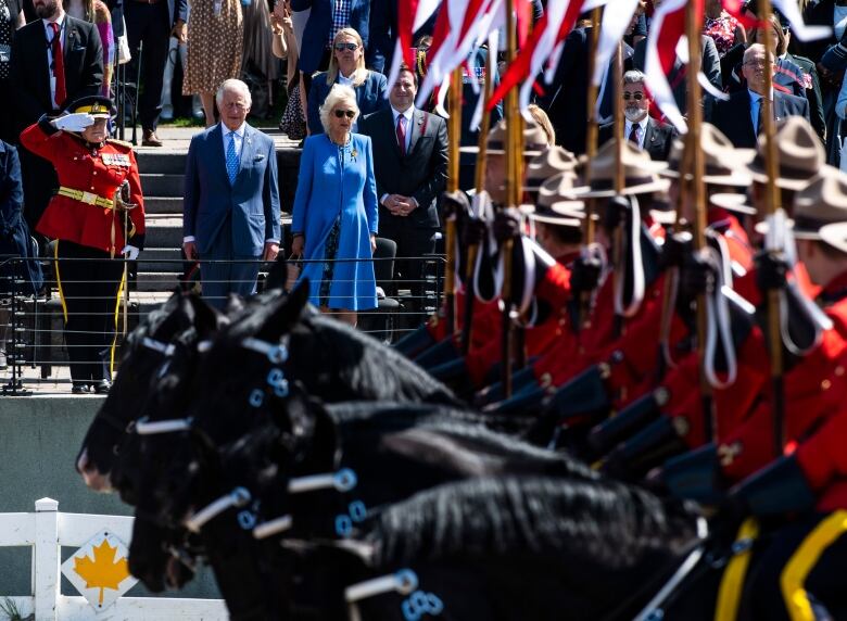 King Charles and Camilla are pictured at a RCMP Musical Ride performance.