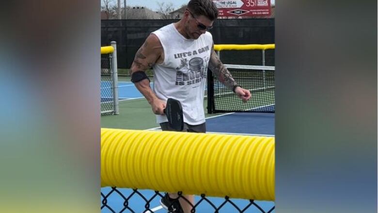 Brad Godin enjoying a friendly round of pickleball.