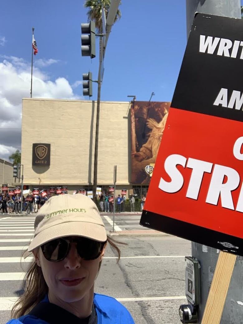 An woman holds a picket sign in LA.