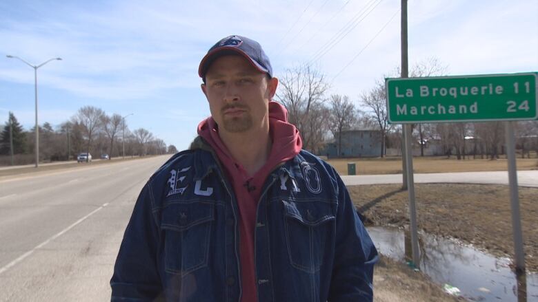 A man walks down the road.