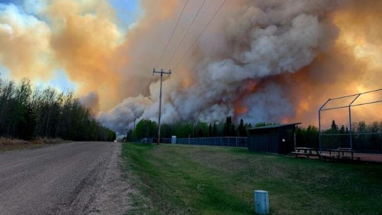 An out-of-control wildfire blazes near the hamlet of Evansburg, in west-central Alberta. Thousands of people have evacuated their homes because of wildfires, but many are trying to save their animals. 