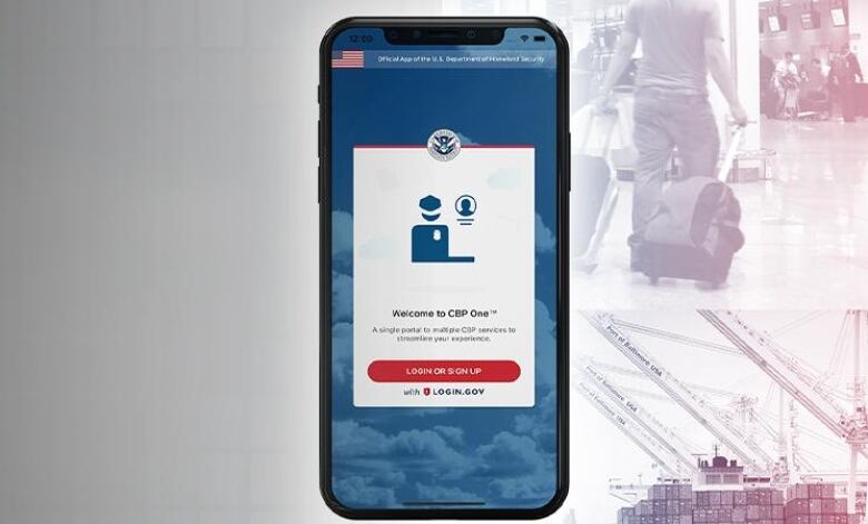 A screen from the CBP One mobile app is seen on a smartphone. 