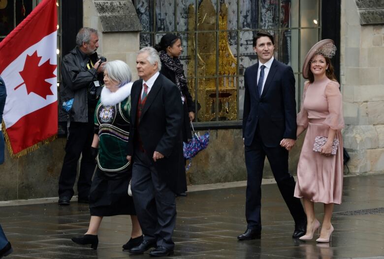 See the prime minister of Canada, Justin Trudeau, arrive at the coronation of King Charles alongside his wife,  Sophie Grgoire Trudeau, on a misty, foggy Saturday in London. Also seen are Gov. Gen Mary Simon and her husband, Whit Fraser.