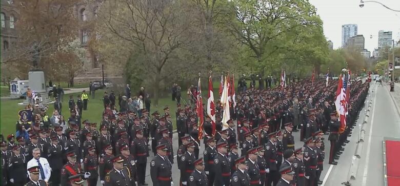 Officers can be seen lining up on Queen Park's Crescent.