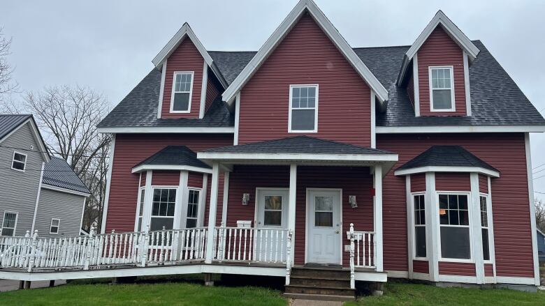 A large home subdivided into apartments is shown. 