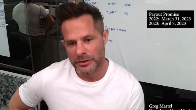 A man in a white T-shirt speaks during a Facebook livestream.