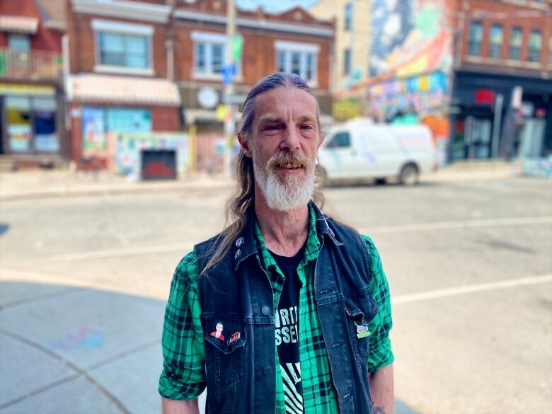 Kensington Market resident Eric Jensen says he feels grateful the land trust bought his property, keeping his rent low.